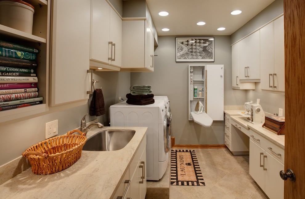 Kitchen with light stone countertops and cabinetry