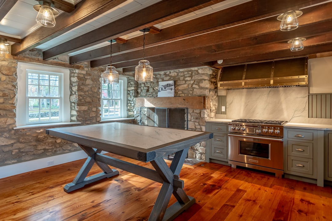 Rustic cabin kitchen with stone countertops and wood cabinetry