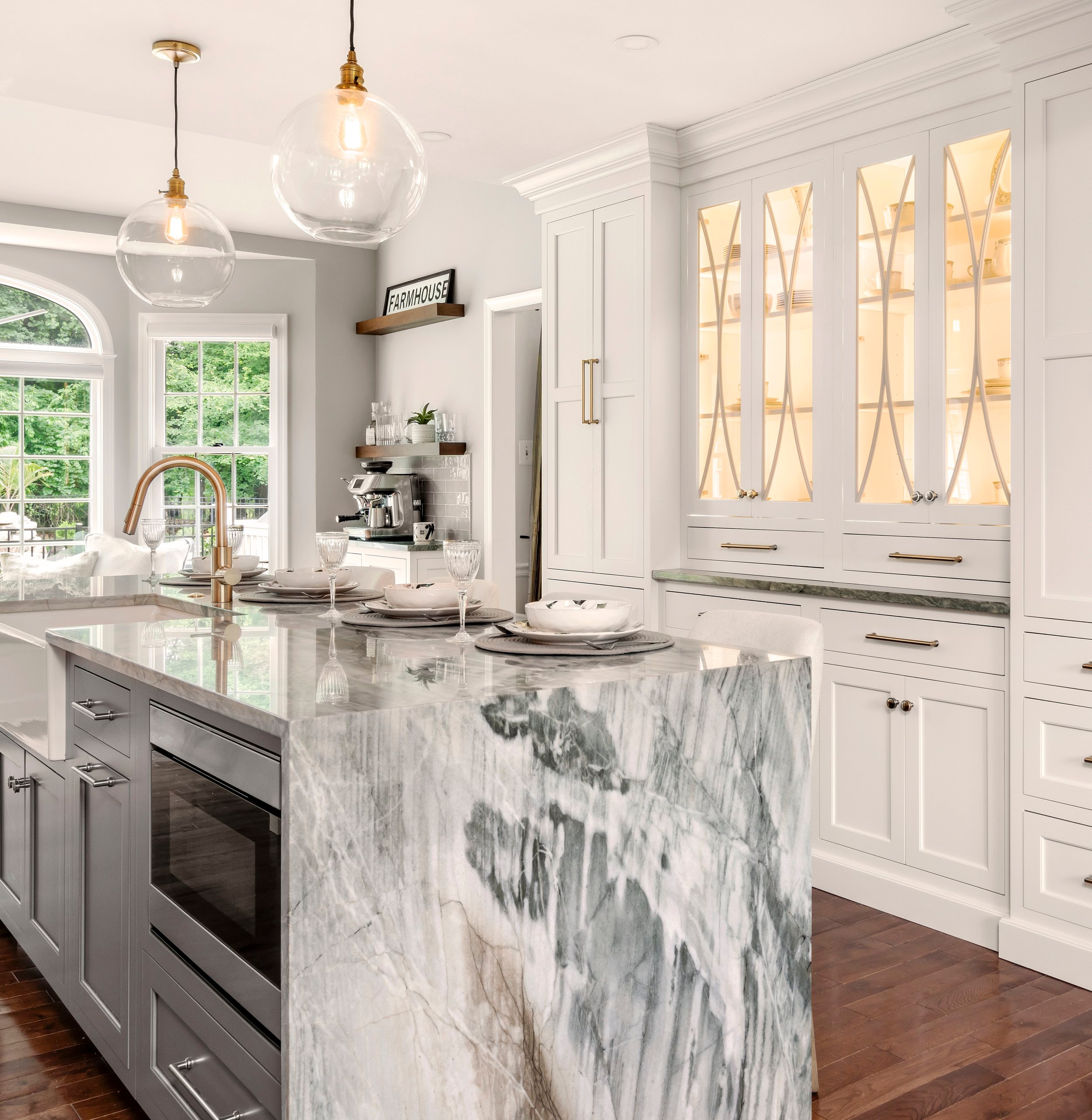 Kitchen with green Santiago quartz countertop and cabinetry