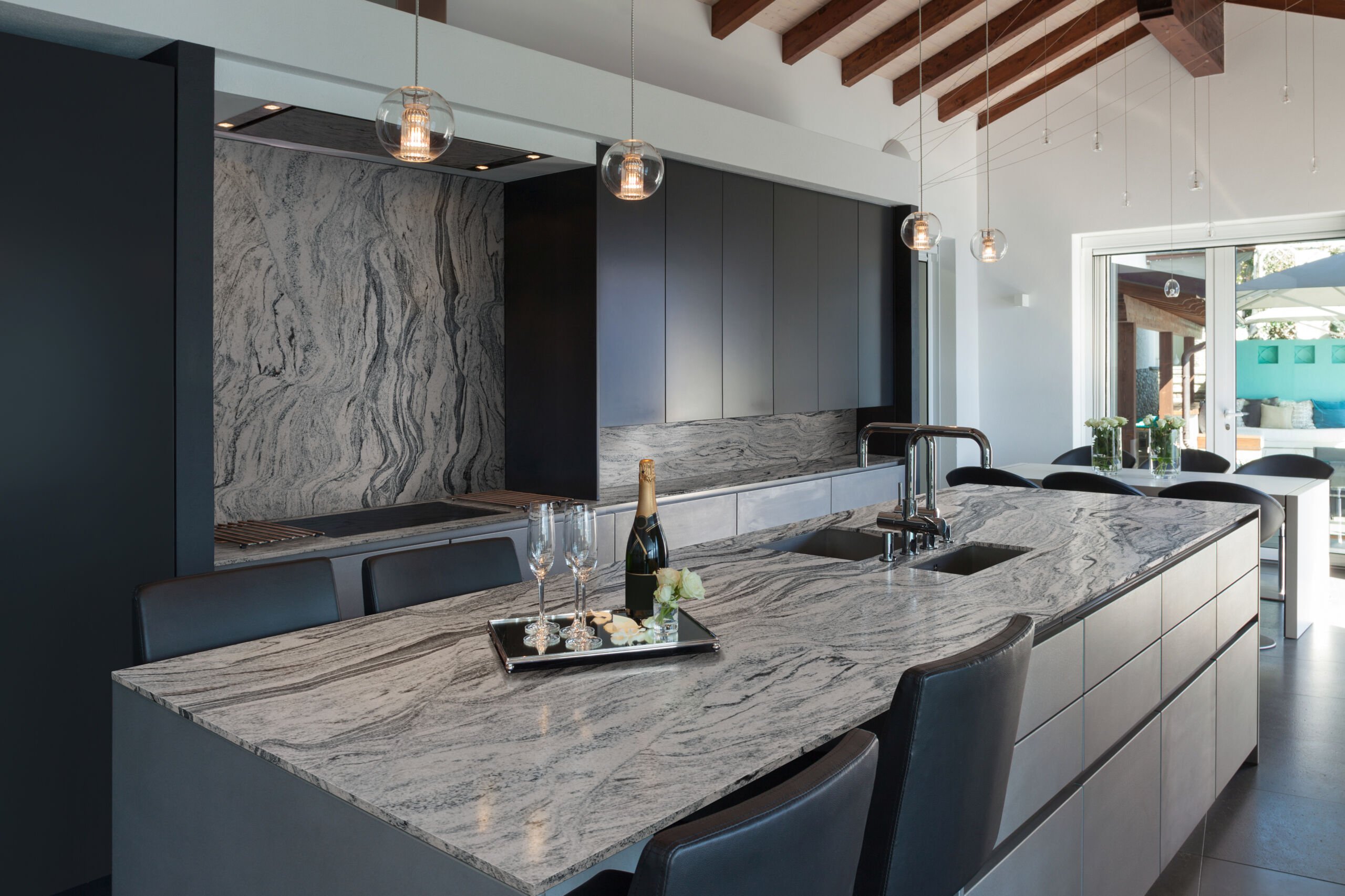 Kitchen with quartz countertops, backsplash, and cabinetry