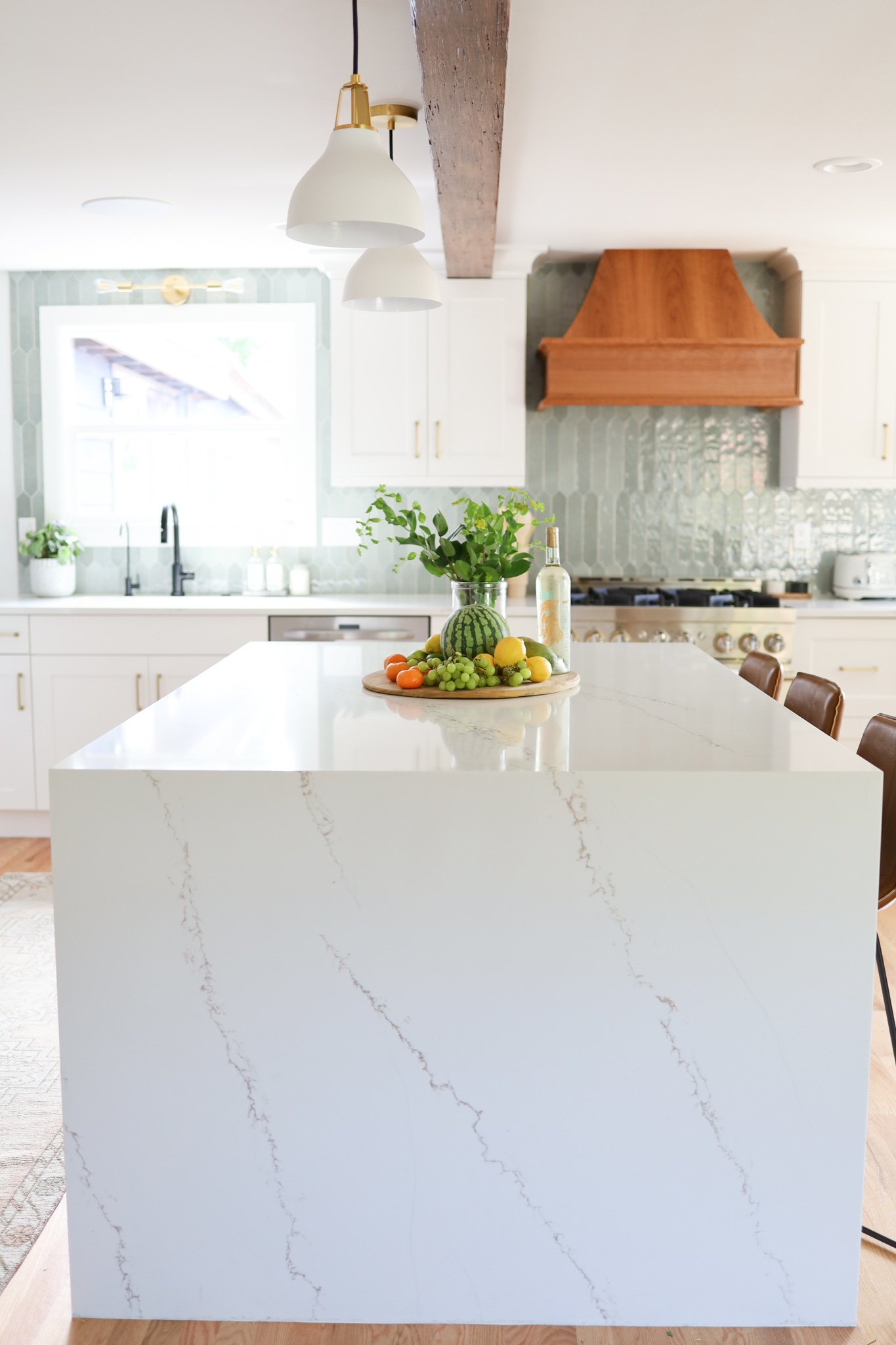 Close-up detail of kitchen countertop and backsplash with stone surface