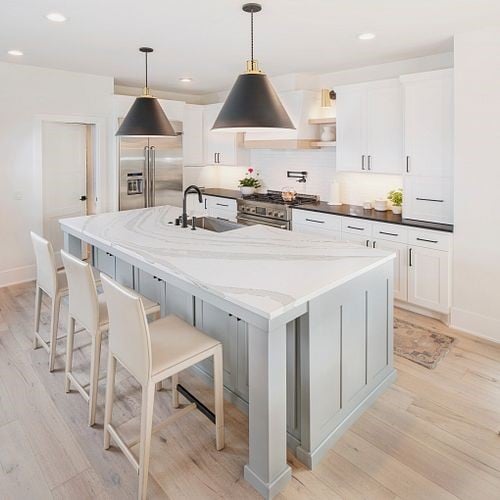Kitchen island with stone countertop and seating