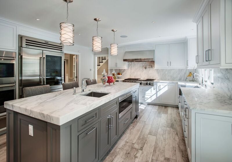Modern kitchen with stone countertops and cabinetry