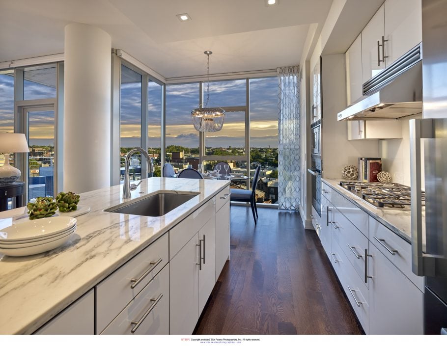Luxury kitchen with stone countertops and modern cabinetry