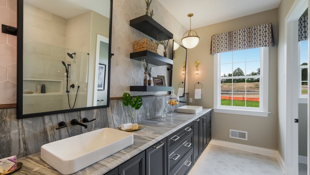 A elegantly designed owner's bathroom featuring modern fixtures, clean lines, and stylish finishes.