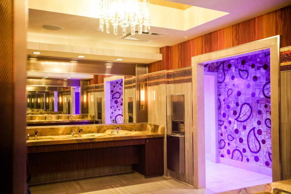 Commercial or hospitality space with stone countertops and modern finishes
