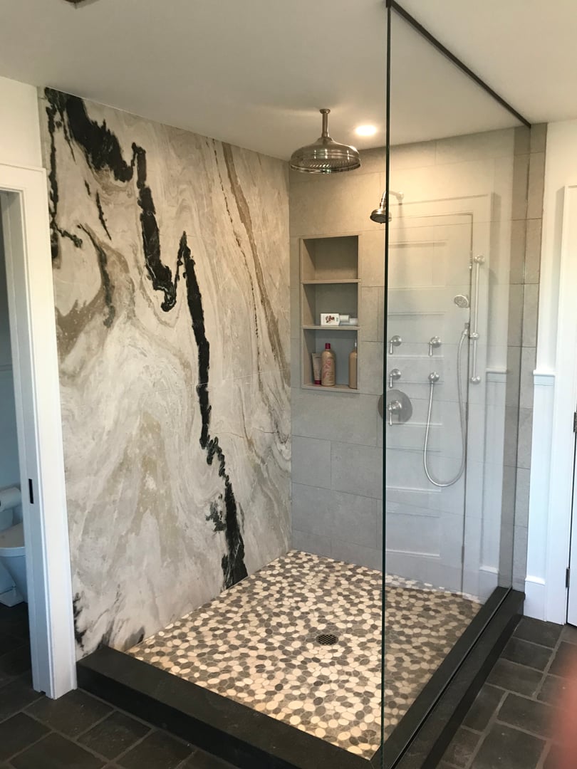 Interior wall clad with large format stone slabs