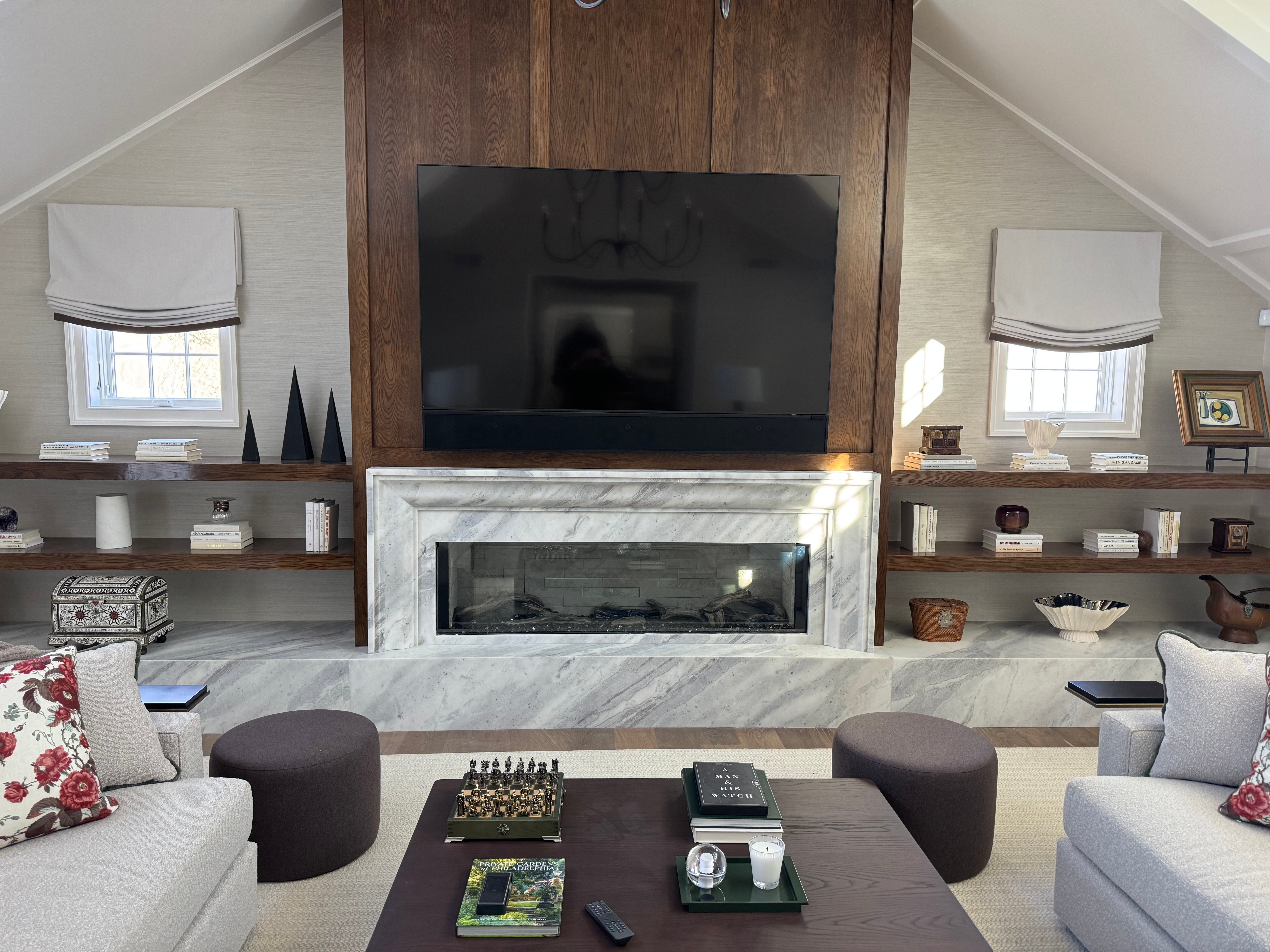 Contemporary living room with a marble fireplace surround featuring dramatic veining